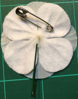 safety pin into felt back